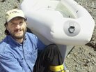 Steven Callahan survived for 76 days adrift in an inflatable life raft. This 2002 photo shows Callahan with an improved life raft he designed after his ordeal. While enduring shark attacks, rain and helpless drifting, Callahan dreamed of a better survival vessel. Once he returned to land, he spent almost two decades designing this one, featuring a rigid exterior, a removable canopy and a sail. Steven Callahan survived for 76 days adrift in an inflatable life raft. This 2002 photo shows Callahan with an improved life raft he designed after his ordeal. While enduring shark attacks, rain and helpless drifting, Callahan dreamed of a better survival vessel. Once he returned to land, he spent almost two decades designing this one, featuring a rigid exterior, a removable canopy and a sail.