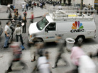 Morning rush hour commuters pass by a CNBC crew in front of the New York Stock Exchange in September 2006. The channel has adopted a policy that prohibits guests from appearing on rival channels amid breaking news. Morning rush hour commuters pass by a CNBC crew in front of the New York Stock Exchange in September 2006. The channel has adopted a policy that prohibits guests from appearing on rival channels amid breaking news.