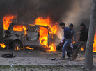 Syrian security agents carry a body following a huge car bombing in Damascus on Thursday. More than 50 people were killed in one of the worst attacks in the capital since the uprising began in 2011. Syrian security agents carry a body following a huge car bombing in Damascus on Thursday. More than 50 people were killed in one of the worst attacks in the capital since the uprising began in 2011.