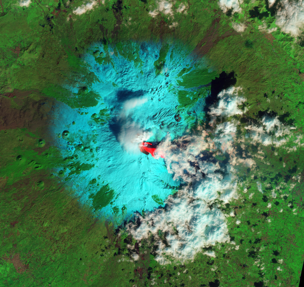 Sicily's Mount Etna early this week, as seen from space. The bright red is lava. Snow is blue-green. Clouds are white. 