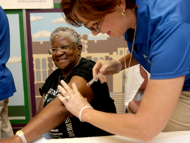 Kimberly Delp gives a flu shot to Carleen Matthews at the Homewood Senior Center in  Pittsburgh, Pa., last September.