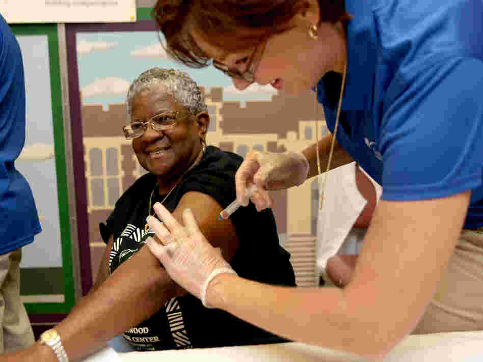 Kimberly Delp gives a flu shot to Carleen Matthews at the Homewood Senior Center in  Pittsburgh, Pa., last September.