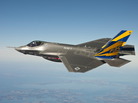 In this image released by the U.S. Navy the U.S. Navy variant of the F-35 Joint Strike Fighter, the F-35C, conducts a test flight over the Chesapeake Bay. In this image released by the U.S. Navy the U.S. Navy variant of the F-35 Joint Strike Fighter, the F-35C, conducts a test flight over the Chesapeake Bay.