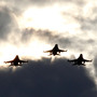 Four F-16s from the 77th Fighter Squadron of Shaw Air Force Base fly over Darlington Raceway before a NASCAR race in Darlington, S.C., in May 2012.