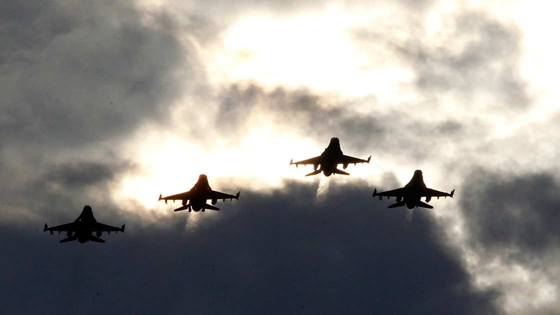 Four F-16s from the 77th Fighter Squadron of Shaw Air Force Base fly over Darlington Raceway before a NASCAR race in Darlington, S.C., in May 2012.