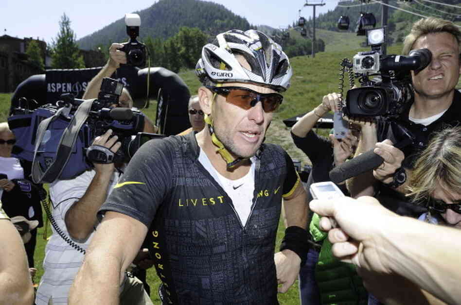 Lance Armstrong finishes the Power of Four Mountain Bike Race on Aspen Mountain on August 25, 2012.
