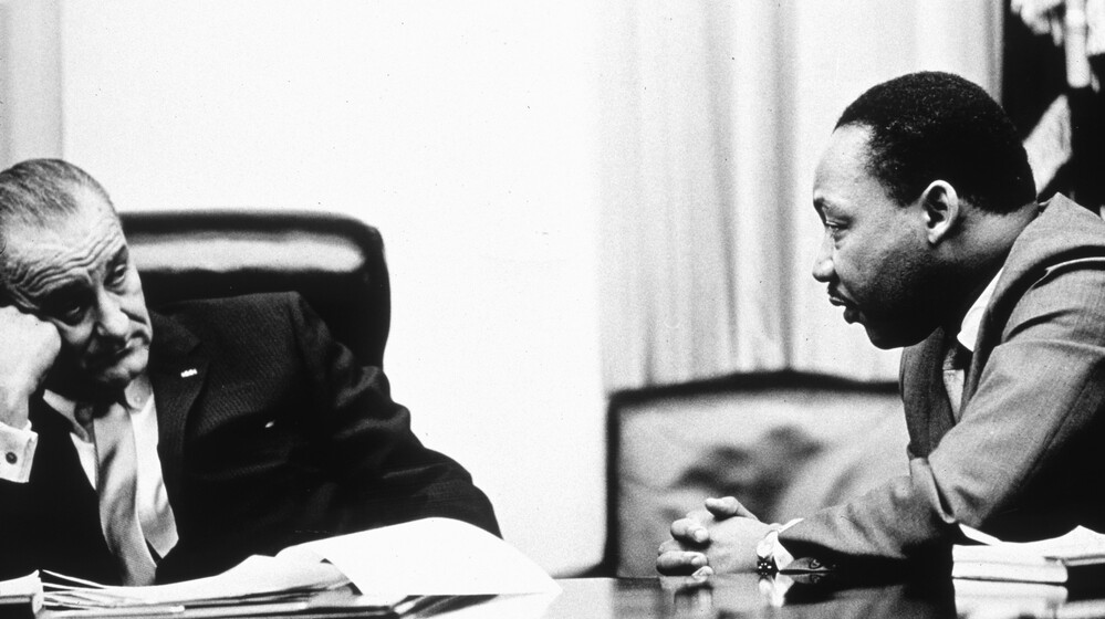 President Lyndon Johnson and civil rights leader Martin Luther King Jr. discuss the Voting Rights Act in 1965. On Wednesday, the Supreme Court hears arguments on whether a key part of the law is still needed nearly a half century after its passage.