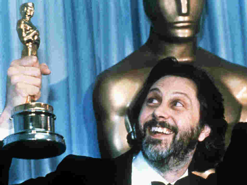 David Putnam, producer of Chariots of Fire, holds up his Oscar after the movie won best picture in 1982.