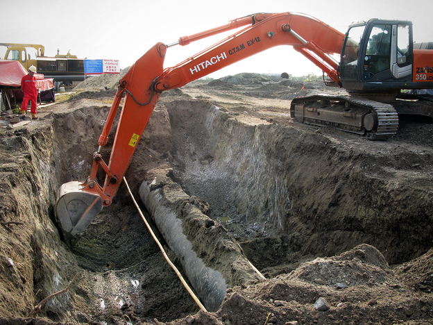 Engineers from China and Myanmar work to bury an oil pipeline outside the Myanmar city of Mandalay. Chinese media reports say the 700-mile-long oil and gas pipelines will be completed in May.
