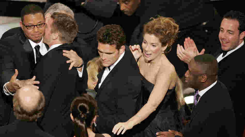 The cast of Crash celebrates after its surprise upset of Brokeback Mountain for best picture, at the 78th Academy Awards in 2006.