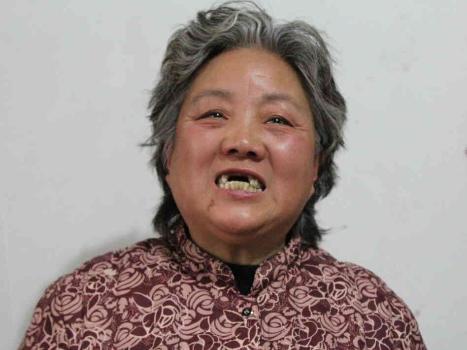 Shen Lixiu, 58, says she had her front teeth kicked out in a re-education through labor camp. Chinese authorities say they are considering "reforms" to a system that is coming under increasing public criticism.