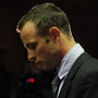 Oscar Pistorius, standing at the dock Friday in a Pretoria courtroom.