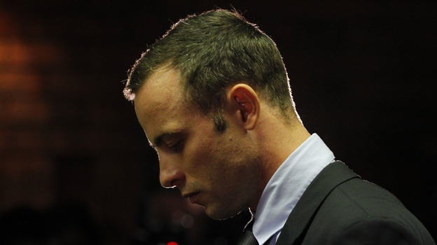 Oscar Pistorius, standing at the dock Friday in a Pretoria courtroom. (Reuters /Landov)