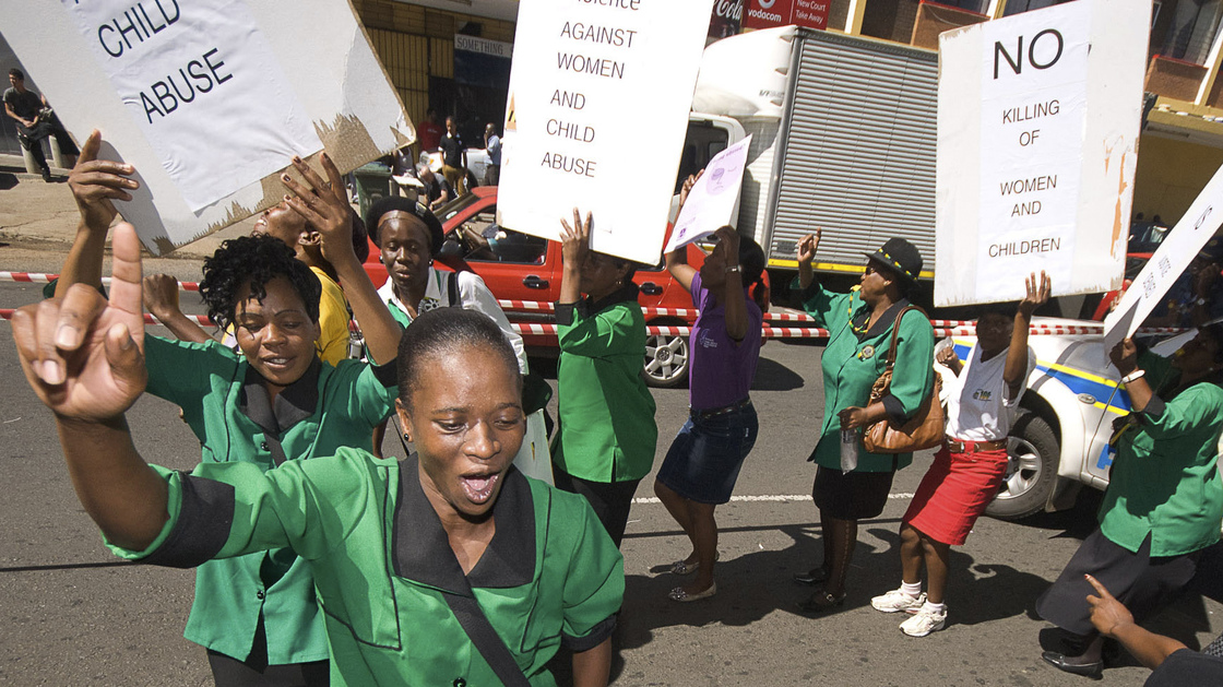 A women's group protests Tuesday outside the courthouse in Pretoria, South Africa, where Oscar Pistorius was attending his bail hearing. Violence against women is widespread in South Africa, and was already part of the national debate before the Pistorius case.