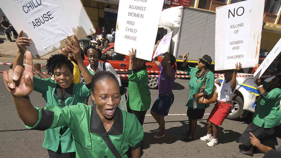 A women's group protests Tuesday outside the courthouse in Pretoria, South Africa, where Oscar Pistorius was attending his bail hearing. Violence against women is widespread in South Africa, and was already part of the national debate before the Pistorius case.