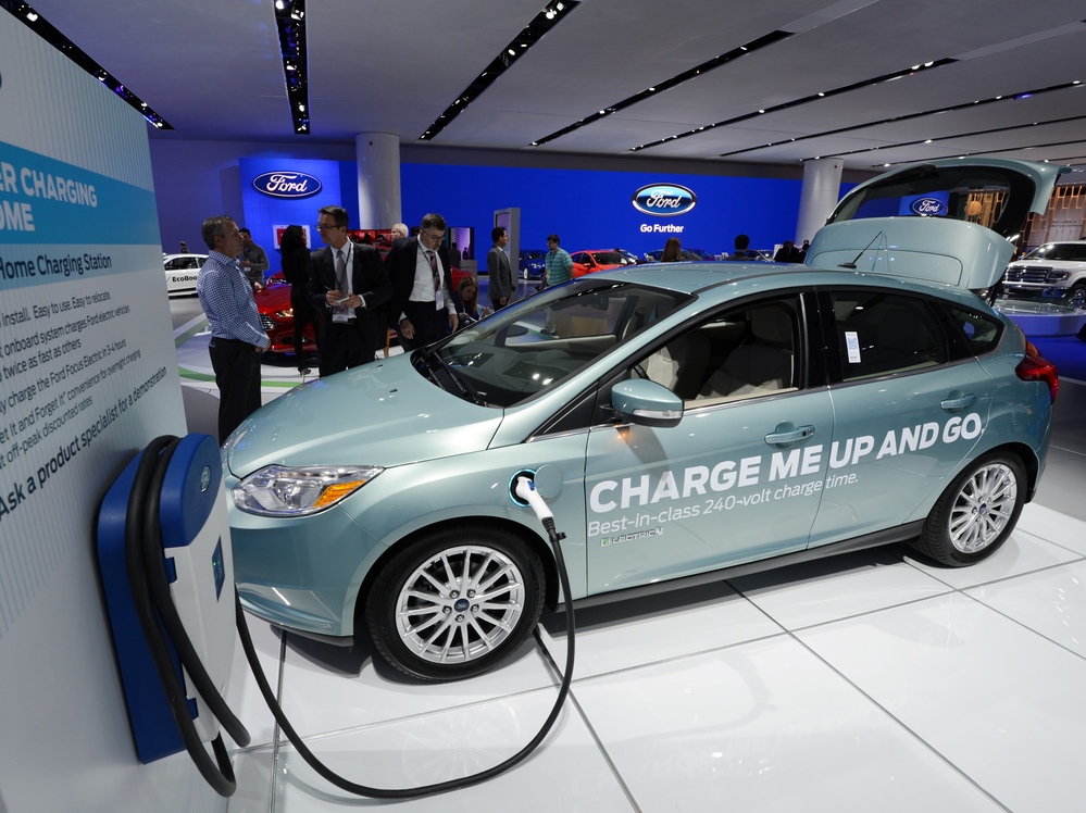 A Ford Focus electric concept car with a home charging unit on display at the 2013 North American International Auto Show in Detroit, Mich., in January.