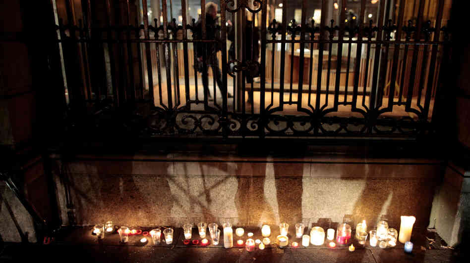 Candles burn outside grounds of Leinster House, placed by relatives of victims of the Catholic-run work houses known as the Magdalene Laundries in Dublin, Ireland, on Feb. 19.