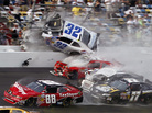 Kyle Larson (32) goes into the catch fence at the conclusion of the NASCAR Nationwide Series auto race Saturday at Daytona International Speedway in Daytona Beach, Fla. Kyle Larson (32) goes into the catch fence at the conclusion of the NASCAR Nationwide Series auto race Saturday at Daytona International Speedway in Daytona Beach, Fla.