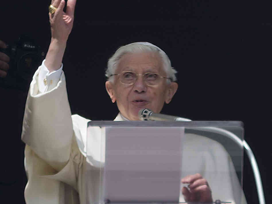 Pope Benedict XVI delivers his blessing Sunday during his last Angelus noon prayer, from the window of his studio overlooking St. Peter's Square at the Vatican.