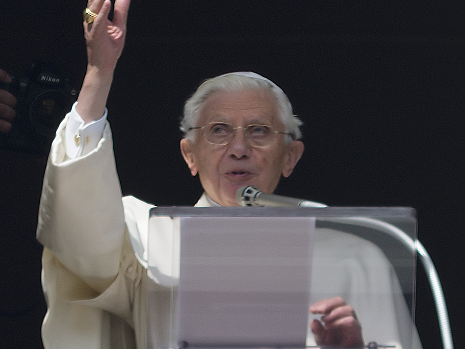 Pope Benedict XVI delivers his blessing Sunday during his last Angelus noon prayer, from the window of his studio overlooking St. Peter's Square at the Vatican.