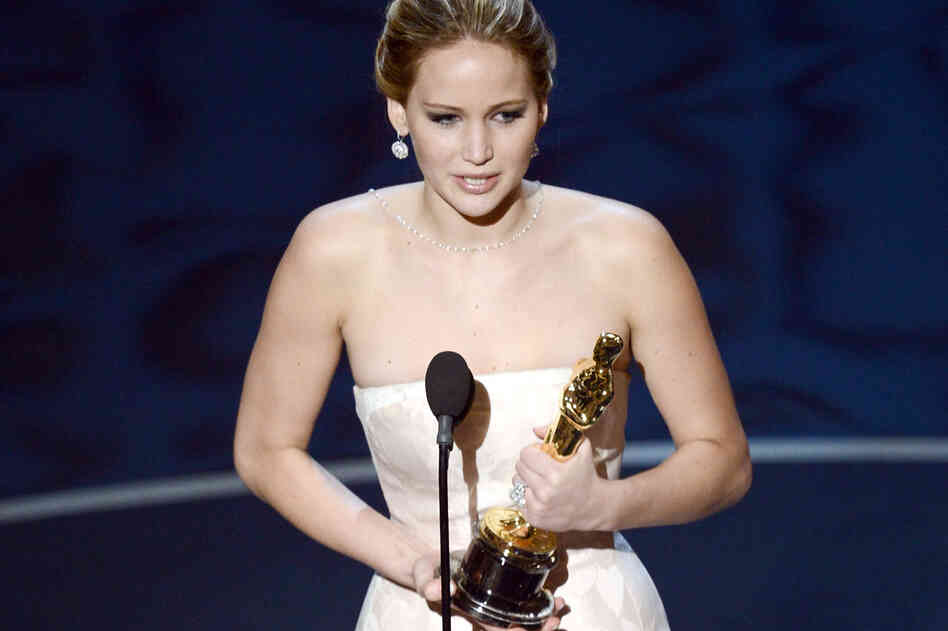 Jennifer Lawrence accepts the Oscar for best actress for her performance in "Silver Linings Playbook."