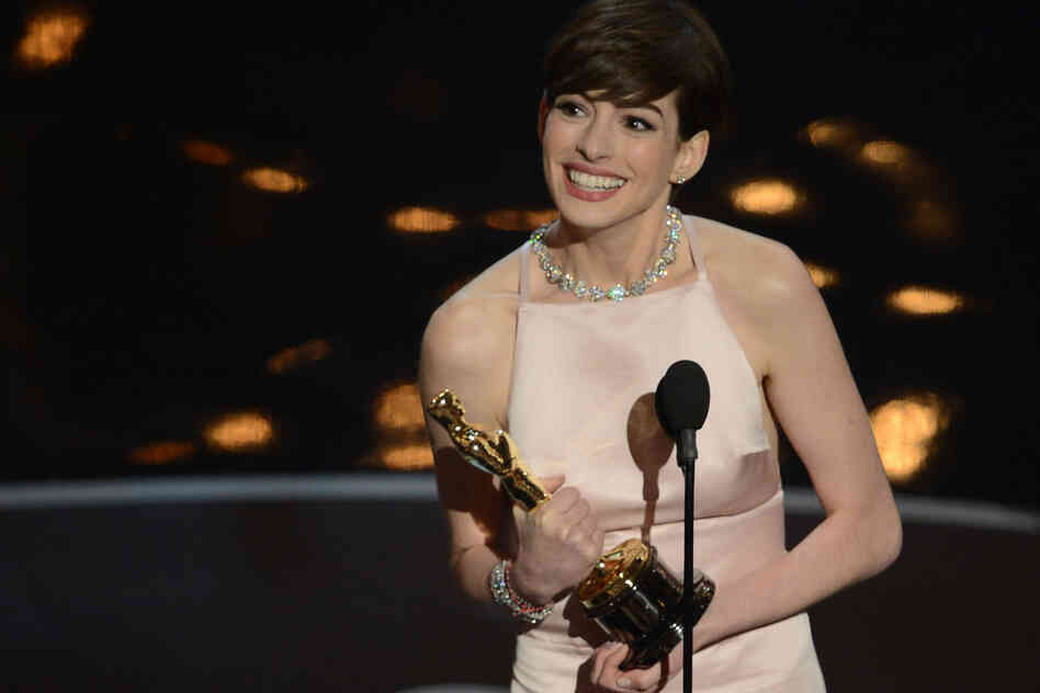 Anne Hathaway accepts the Oscar for best supporting actress for her role in "Les Miserables."