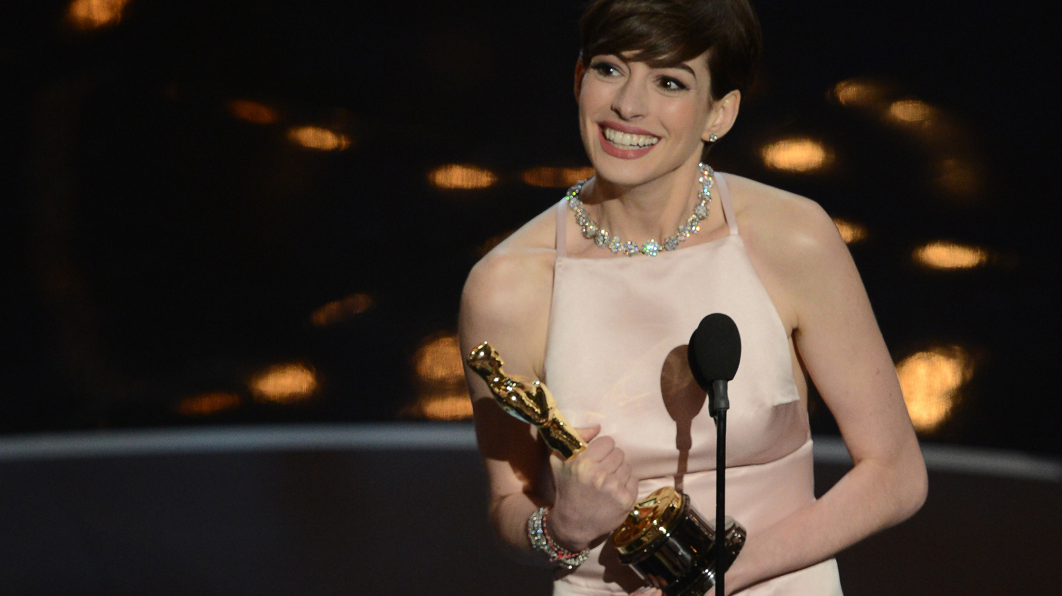 Anne Hathaway accepts the Oscar for best supporting actress for her role in "Les Miserables."