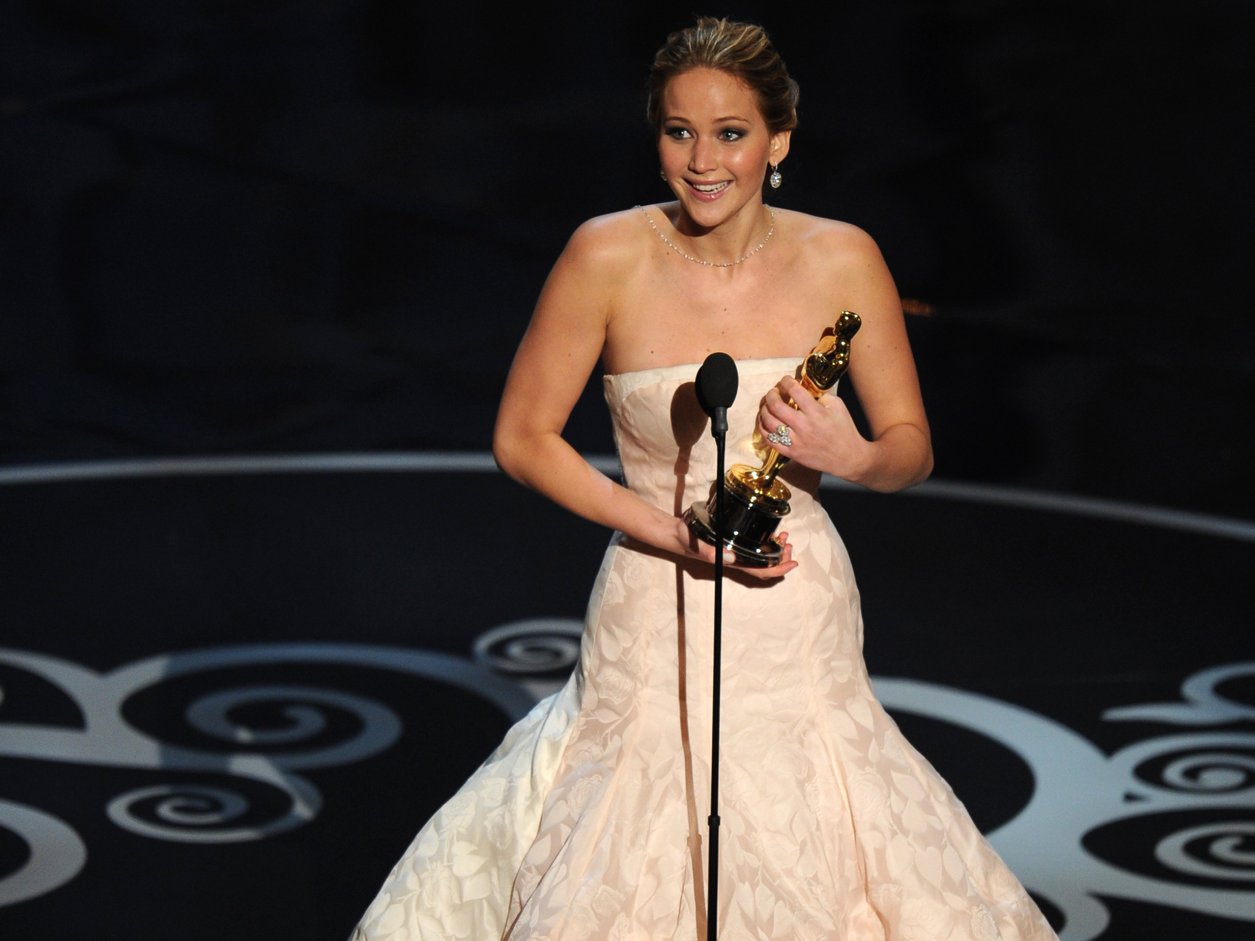 Jennifer Lawrence accepts the Oscar for best actress in Silver Linings Playbook.