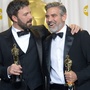 Ben Affleck (center), George Clooney (right) and Grant Heslov celebrate in the press room after winning the Oscar for best picture for Argo.