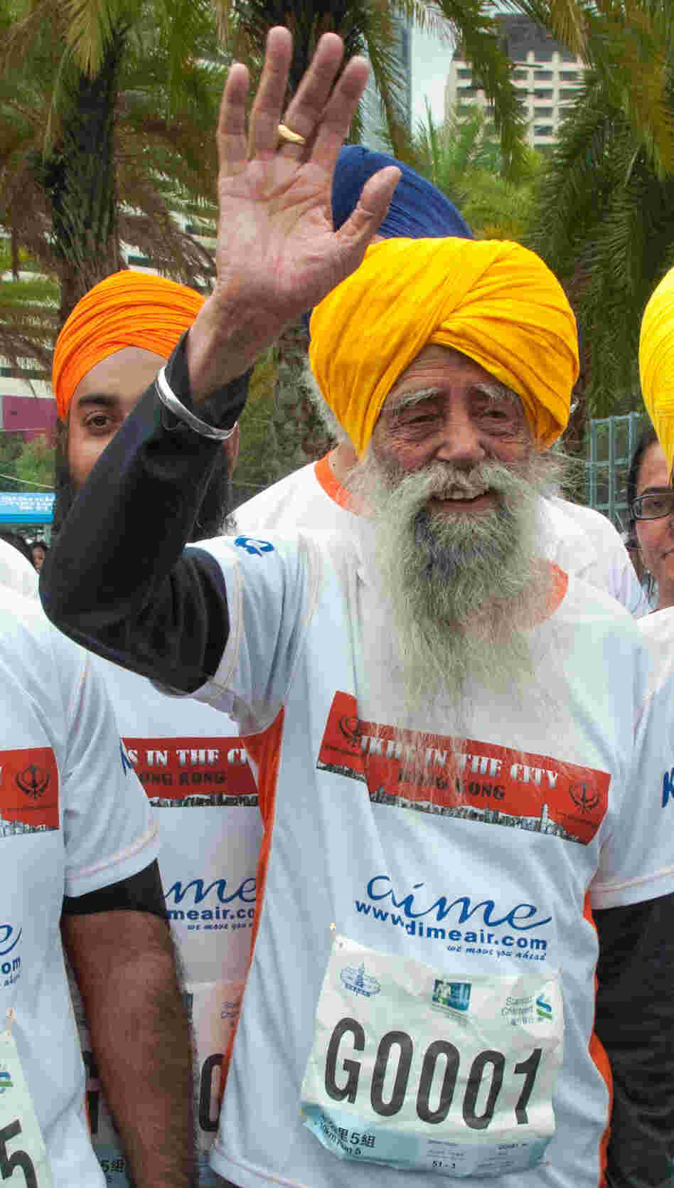 Fauja Singh, the 101-year-old "turbaned tornado," with other runners Sunday in Hong Kong. Fauja Singh, the 101-year-old "turbaned tornado," with other runners Sunday in Hong Kong.