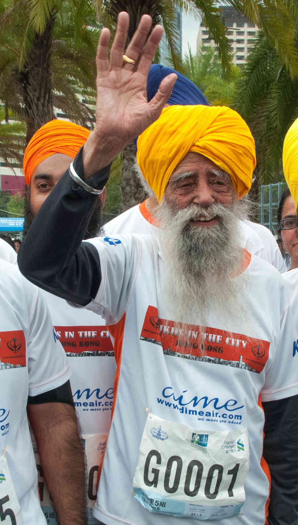 Fauja Singh, the 101-year-old "turbaned tornado," with other runners Sunday in Hong Kong. Fauja Singh, the 101-year-old "turbaned tornado," with other runners Sunday in Hong Kong.