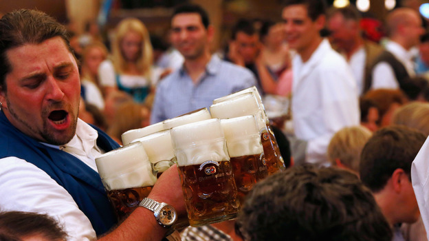 A waiter carries beer mugs during the 2012 Oktoberfest in Munich. (Getty Images)