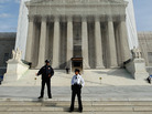 U.S. Supreme Court Police officers stand on the steps in front of the court building in November. U.S. Supreme Court Police officers stand on the steps in front of the court building in November.