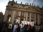 A church group prepares to pray for Pope Benedict XVI on the steps of St. Peter's Basilica on Tuesday. A church group prepares to pray for Pope Benedict XVI on the steps of St. Peter's Basilica on Tuesday.