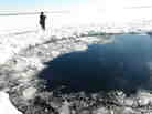 A circular hole in the ice of Chebarkul Lake, where the Chelyabinsk meteor reportedly struck on Feb. 15.