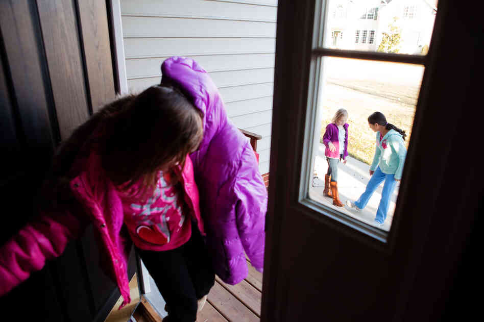 Laura, 6 (from left), Anna, 8, and Anita, 13, head out to the cul-de-sac to play before dinner. The kids get most of their exercise roller-skating, biking or playing ball after school.