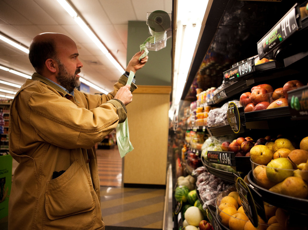 Brown stops by the grocery story after work to pick up ingredients for a fruit salad that he plans to make for dinner.