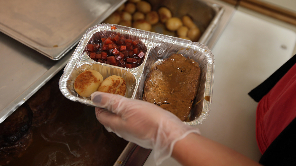 A nutrition specialist prepares a Meals on Wheels delivery in upstate New York. The national organization says the sequester could mean significant cuts in the number of meals they serve to homebound seniors.