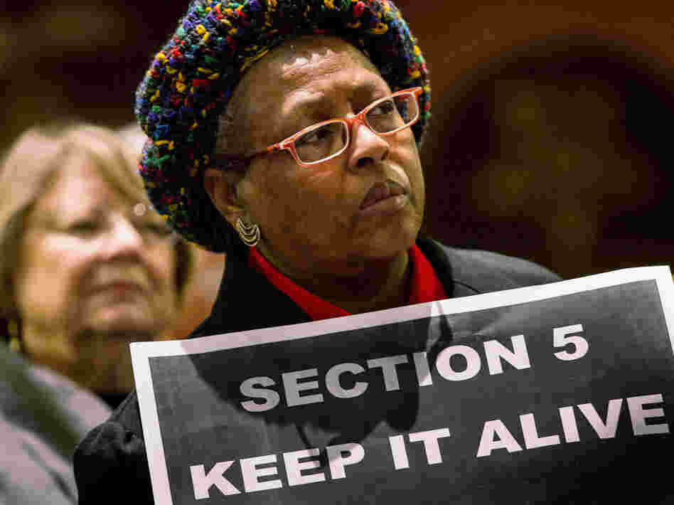 A supporter of the Voting Rights Act attends a rally Columbia, S.C., on Tuesday.