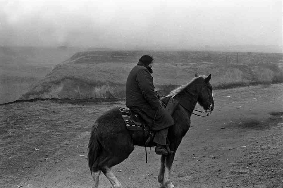 Vietnam veteran, Sid Mills, a Yakima man, stands guard.