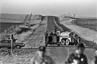 The FBI blocks the road.