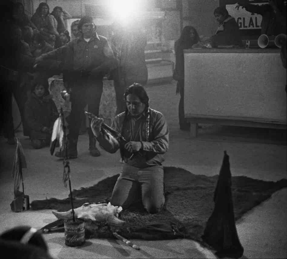 Leonard Crow Dog, spiritual leader of the American Indian Movement, prepares a chanupa (pipe) for prayers.