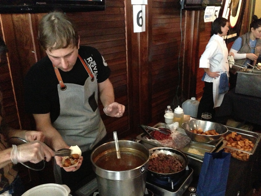 Art Jackson of Pleasant House Bakery prepares his take, which uses skirt steak, and chunky British chips in the place of fries.