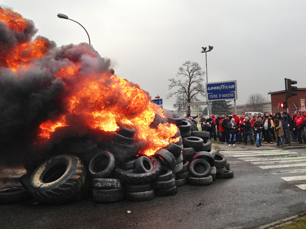 French workers burn tires outside the Goodyear tire factory in Amiens, France, on Tuesday, after Titan CEO Maurice Taylor criticized French workers in a letter addressed to Industrial Renewal Minister Arnaud Montebourg.