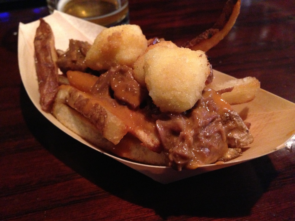 Little Market's poutine served in its traditional dish, a seven-passenger boat.