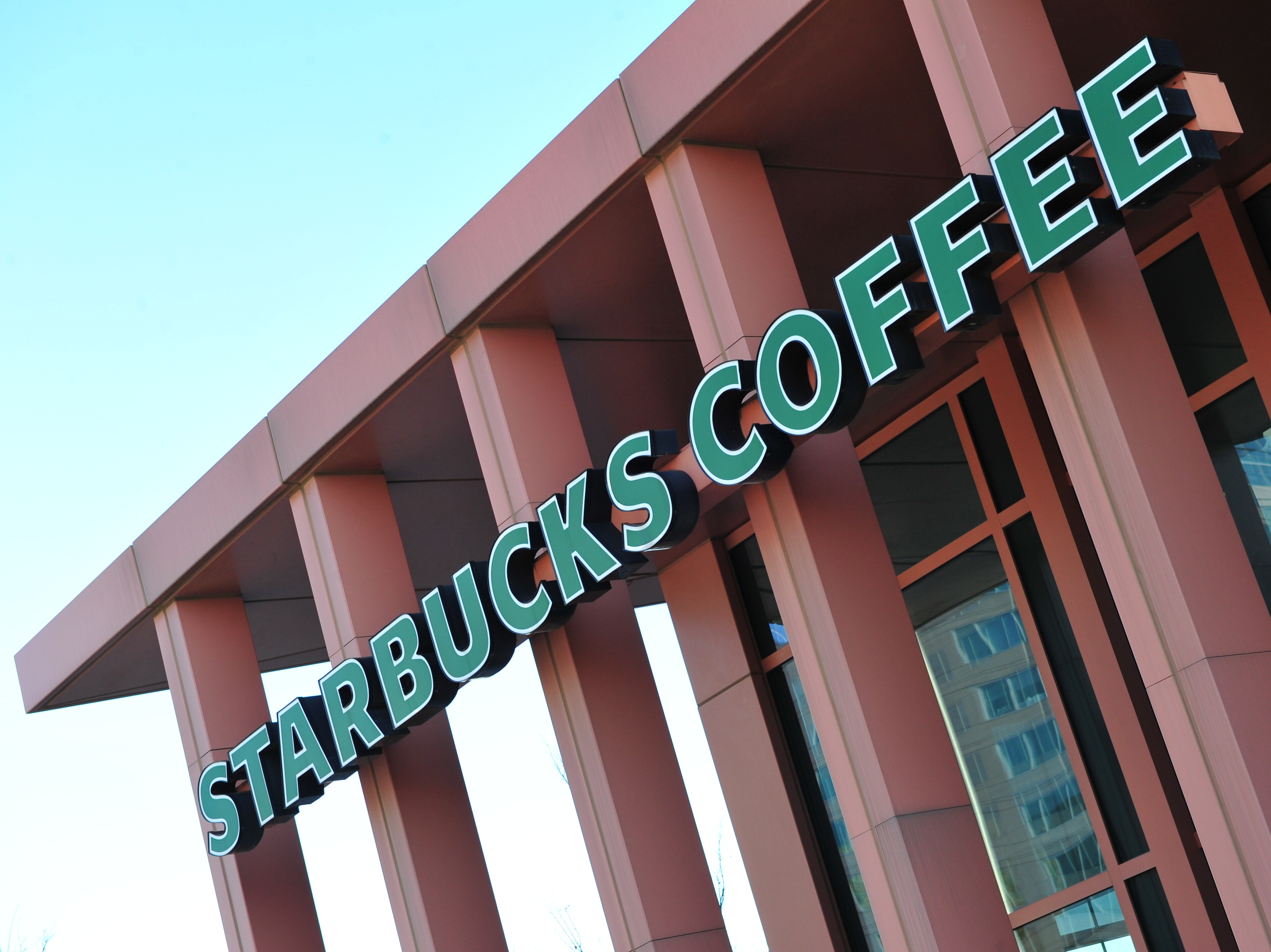 Starbucks is among the companies urging the Supreme Court to strike down the federal government's ban on recognizing same-sex marriages.