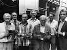 The Great Train Robbers (from left): Buster Edwards, Tom Wisbey, Jim White, Bruce Reynolds, Roger Cordrey, Charlie Wilson and Jim Hussey, with copies of their book The Train Robbers in 1979.