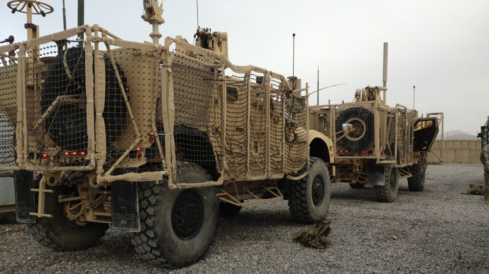 A pair of mine-resistant, ambush-protected vehicles are lined up for a convoy to Kandahar Airfield. One of the trucks broke down before leaving Forward Operating Base Frontenac. The unit has to move out 50 vehicles from the compound.