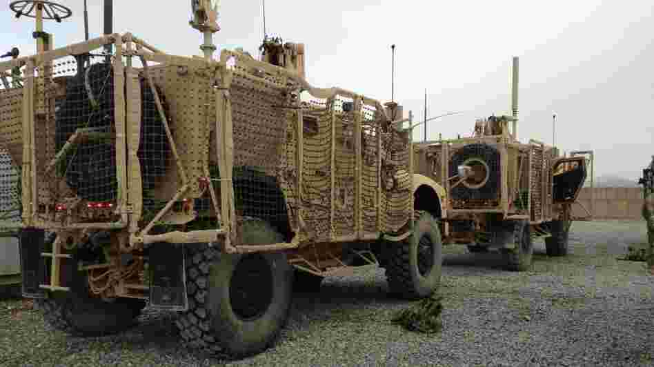 A pair of mine-resistant, ambush-protected vehicles are lined up for a convoy to Kandahar Airfield. One of the trucks broke down before leaving Forward Operating Base Frontenac. The unit has to move out 50 vehicles from the compound.