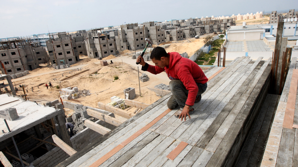 A Palestinian laborer works at the site of a residential construction project funded by the United Nations Relief and Works Agency for Palestine Refugees in Rafah, in the southern Gaza Strip, on Mar. 21, 2012.